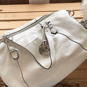 Michael Kors cross-body with silver jewelry